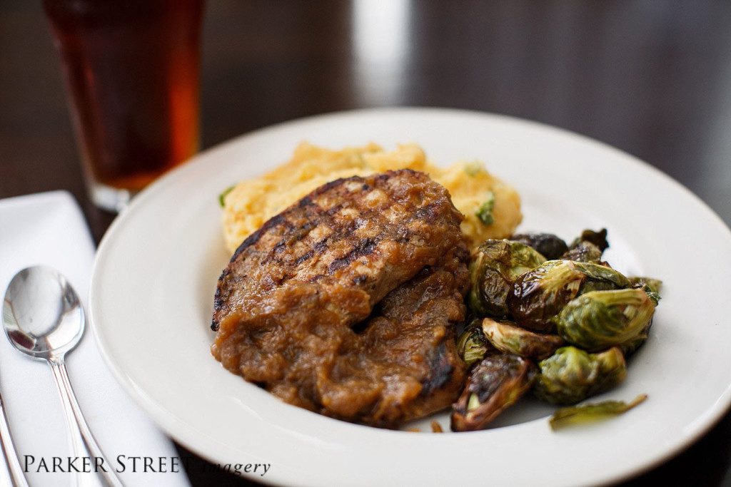 Professional photo of Grilled Pork Chop Entree | Black Forest Cafe | Amherst, NH | Goffstown Food Photographer