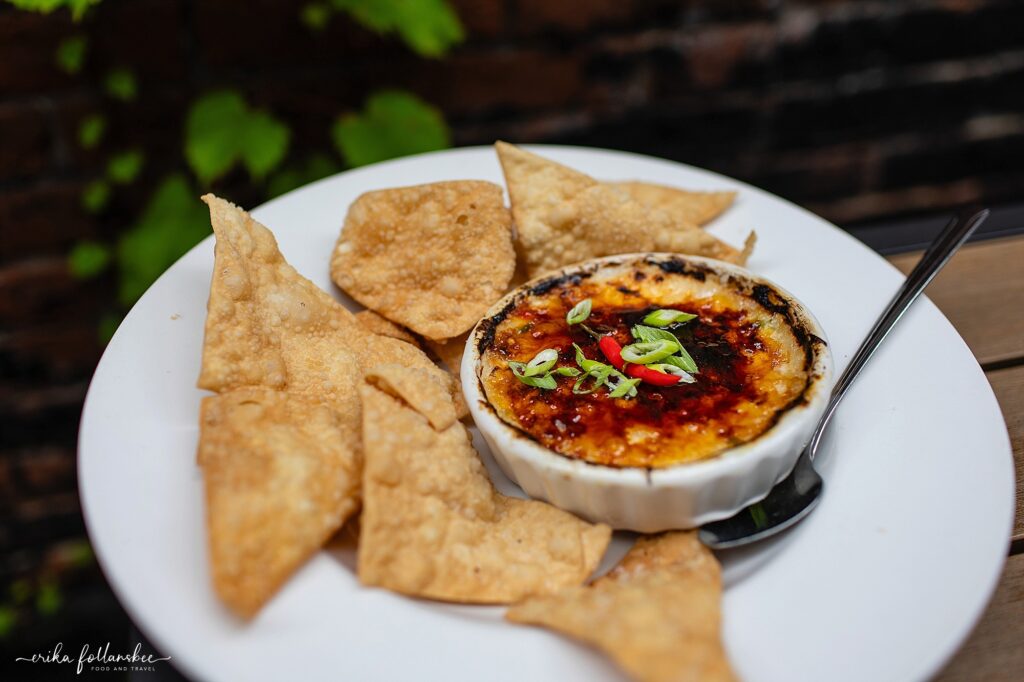 Outdoor seating in The Grotto at The Stage Restaurant in Keene NH | Crab Brulee appetizer